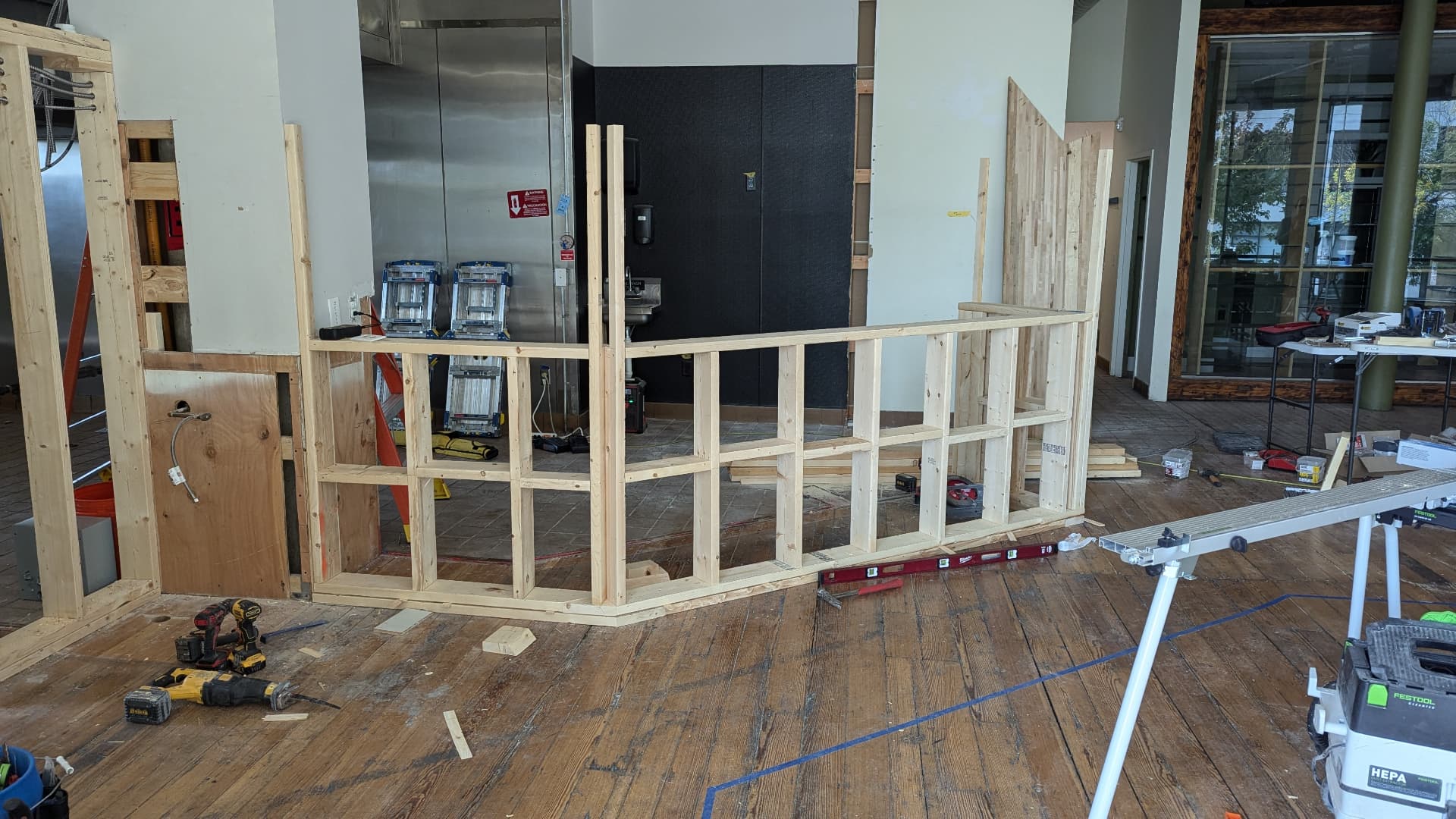 Wood-framed service counter under construction in a Portland, Maine cafe
